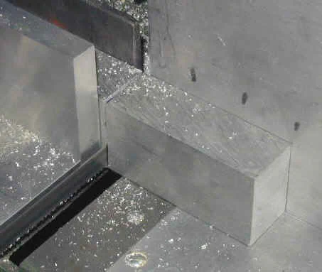 Piece of aluminum being cut