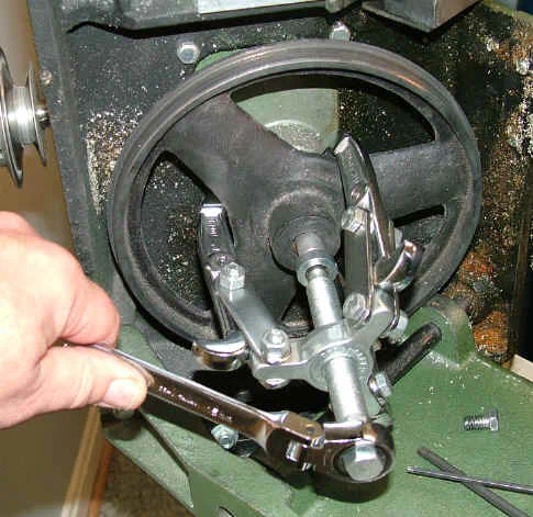 Using gear puller to remove lower pulley